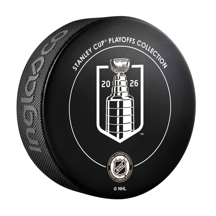 Black NHL Stanley Cup Playoffs Collection souvenir puck back with white 2026 Cup crest and licensed product seal