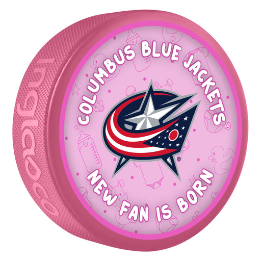 NHL Columbus Blue Jackets New Fan Is Born pink souvenir hockey puck with star and stripes cannon logo on baby-themed background