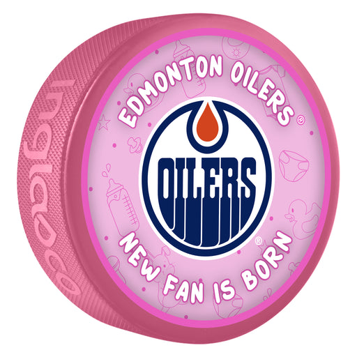 NHL Edmonton Oilers New Fan Is Born pink souvenir hockey puck with team Oilers oil drop logo on baby-themed background